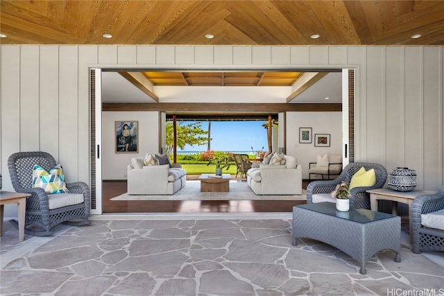 living room featuring hardwood / wood-style floors and wooden ceiling