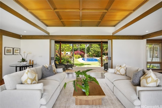 living room with coffered ceiling, wood ceiling, light wood-type flooring, and a healthy amount of sunlight