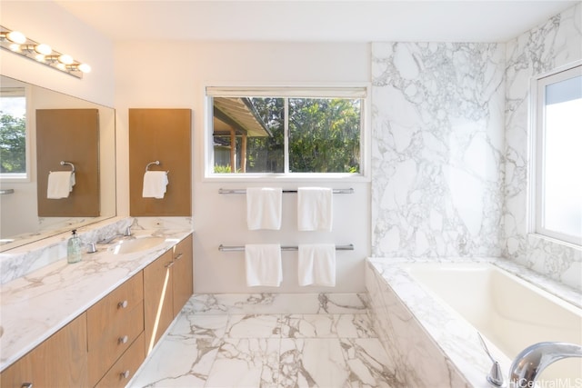 bathroom with vanity and a relaxing tiled tub