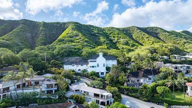 birds eye view of property with a mountain view