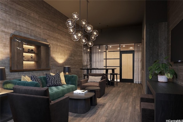 living area with a chandelier, wood finished floors, and a high ceiling