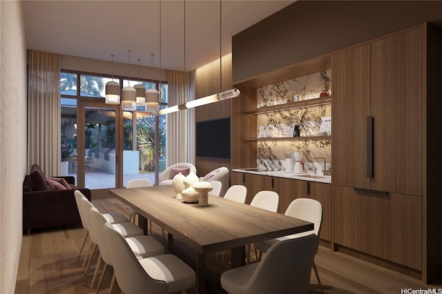 dining area featuring light wood-style flooring