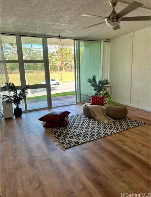 sunroom / solarium with ceiling fan