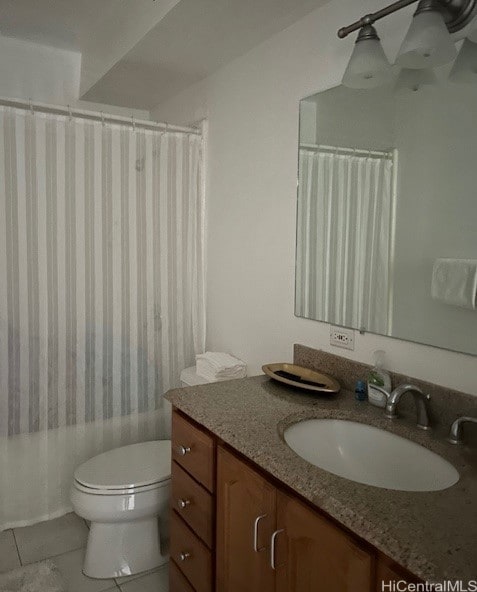 bathroom featuring vanity, toilet, and tile patterned floors