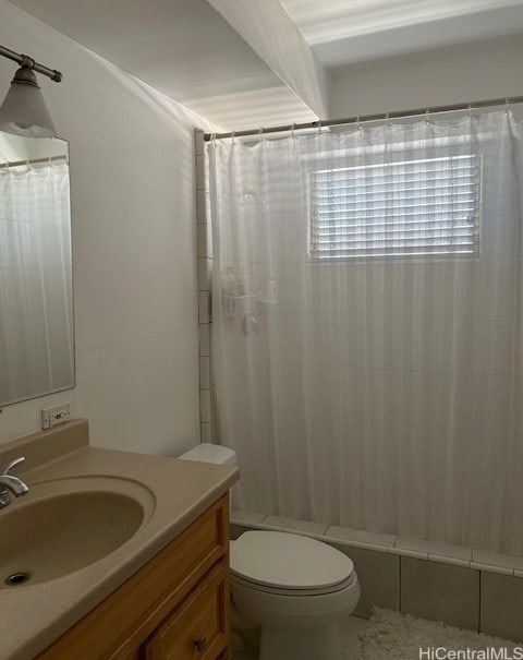 full bathroom with vanity, toilet, and shower / tub combo with curtain