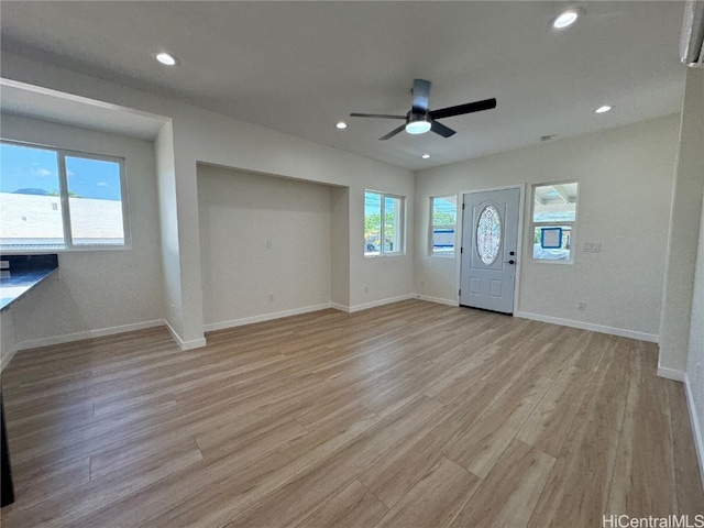 entrance foyer featuring light hardwood / wood-style flooring and ceiling fan