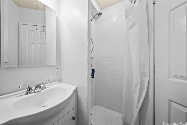 bathroom featuring vanity and walk in shower