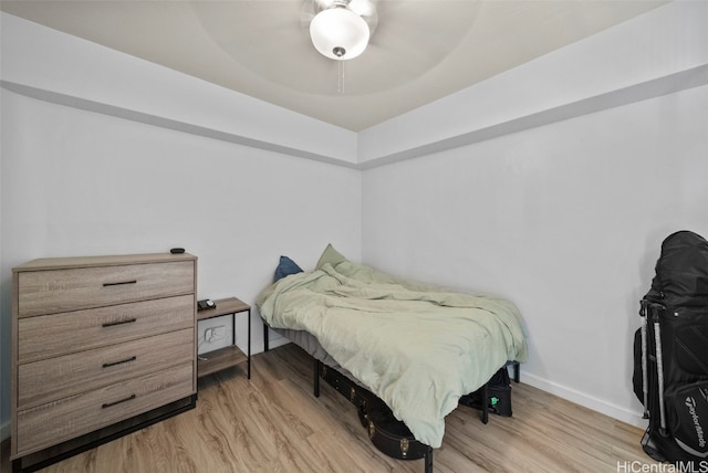 bedroom featuring ceiling fan and light hardwood / wood-style flooring