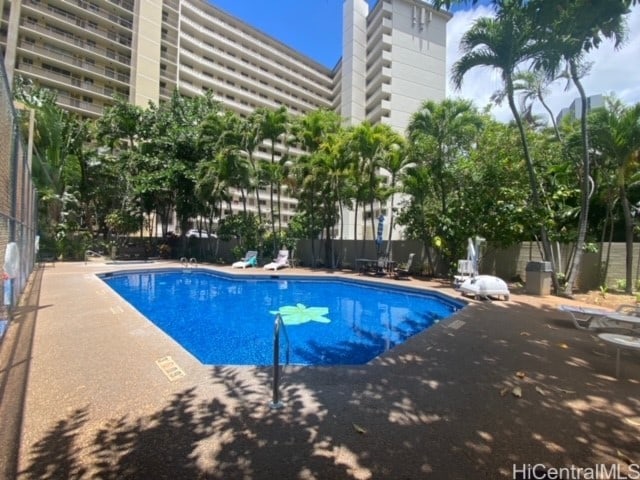 view of swimming pool with a patio area