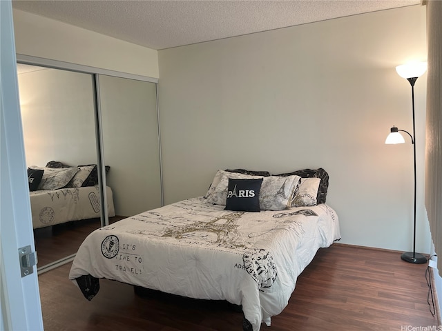 1314 Kalakaua Ave Unit 706, Honolulu, HI 96826 - bedroom with wood finished floors, a closet, and a textured ceiling