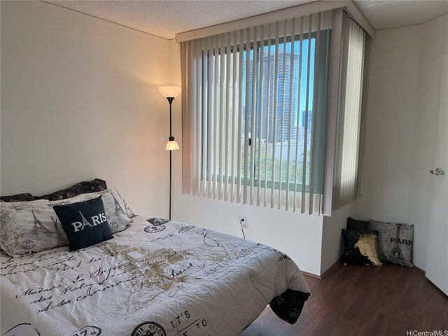 1314 Kalakaua Ave Unit 706, Honolulu, HI 96826 - bedroom with wood finished floors