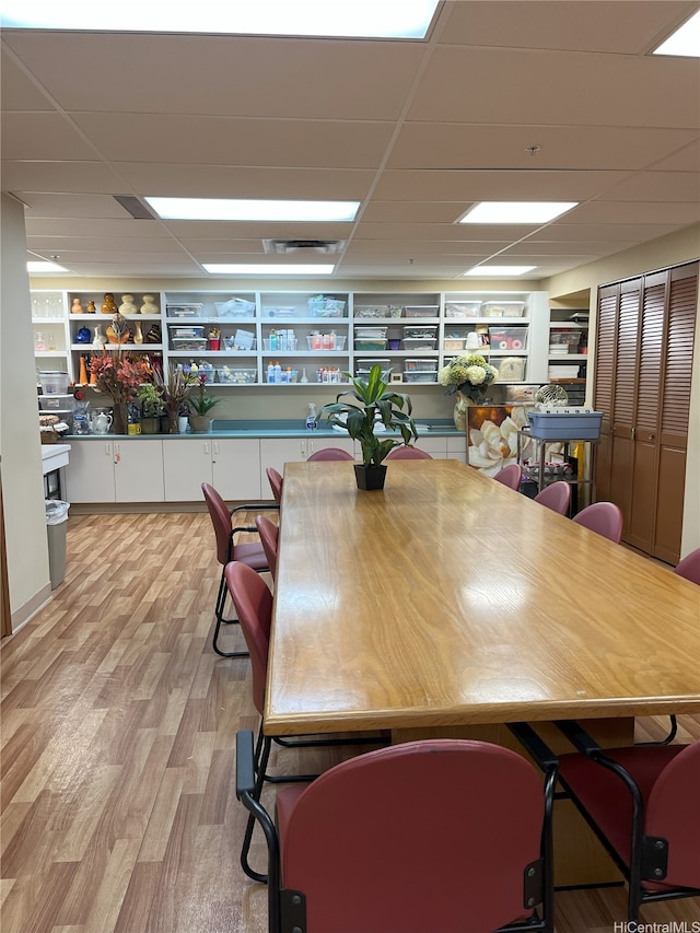 1314 Kalakaua Ave Unit 706, Honolulu, HI 96826 - dining space with a drop ceiling, light wood-type flooring, and built in features