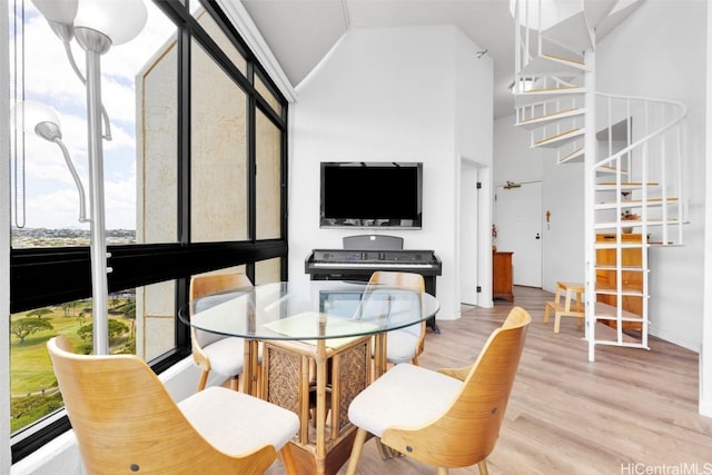 interior space featuring lofted ceiling and light wood-type flooring