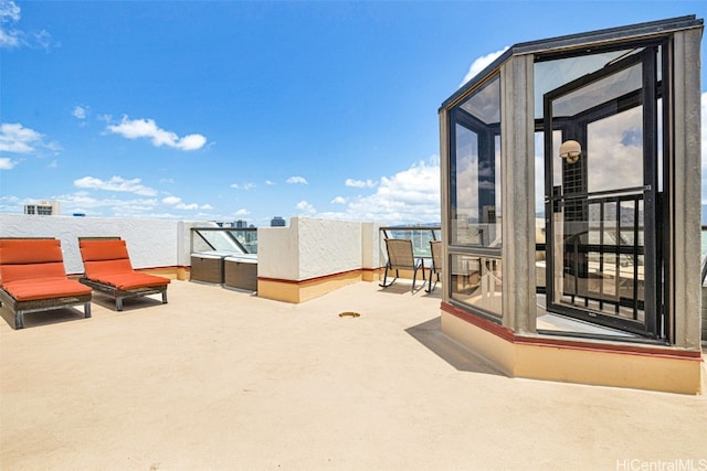 view of patio / terrace with a balcony