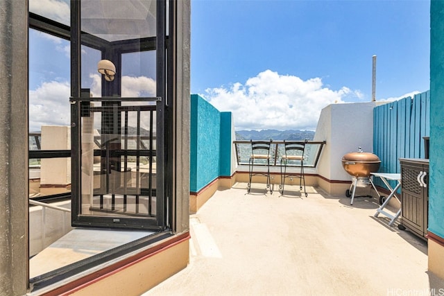 balcony featuring a mountain view