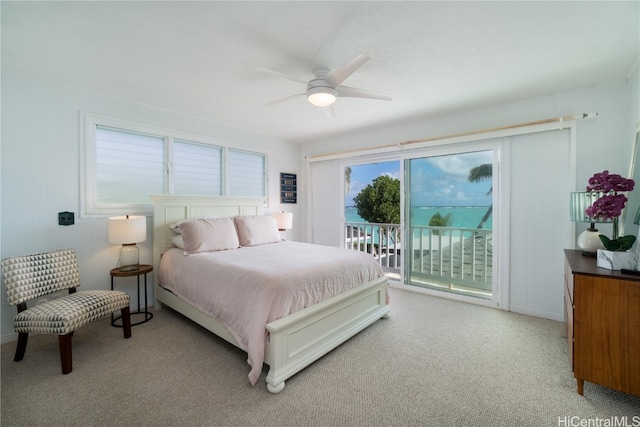 bedroom featuring access to outside, light colored carpet, and ceiling fan