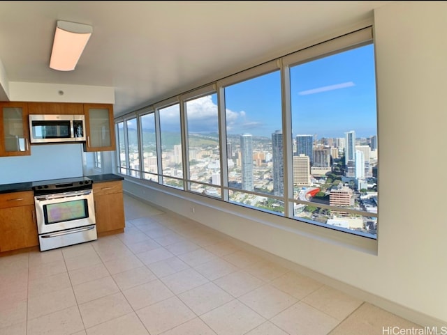 kitchen featuring stainless steel appliances and light tile patterned floors