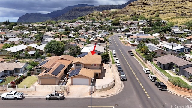 birds eye view of property featuring a mountain view