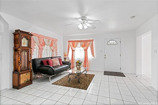 living room featuring light tile patterned floors and ceiling fan