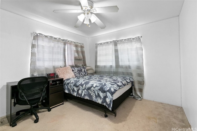 bedroom featuring light carpet and ceiling fan