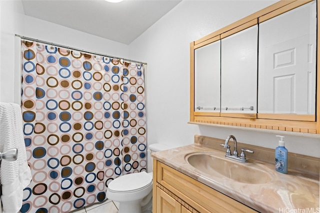 bathroom featuring vanity, curtained shower, toilet, and tile patterned flooring