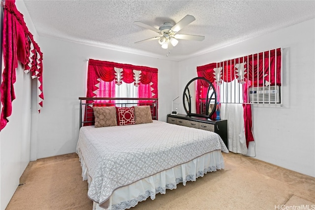 bedroom with carpet, a textured ceiling, and ceiling fan