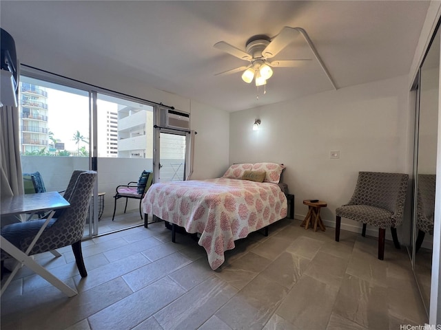 2463 Kuhio Ave Unit 405, Honolulu, HI 96815 - bedroom with access to exterior and a ceiling fan