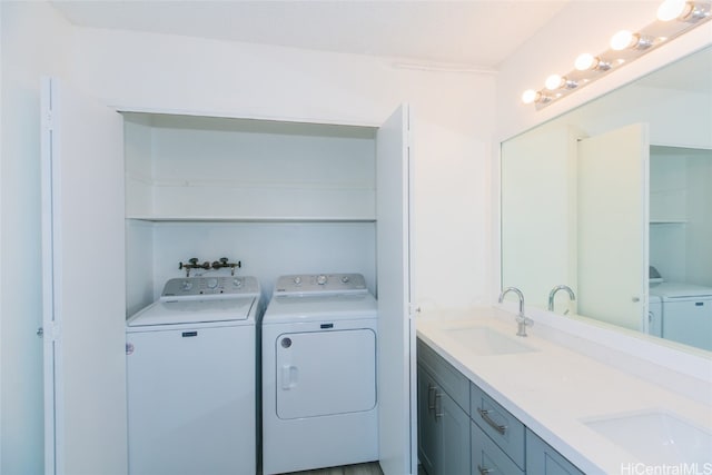 washroom featuring sink and washing machine and clothes dryer