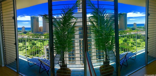 1925 Kalakaua Ave Unit 1902, Honolulu, HI 96815 - entryway featuring a city view, a water view, and wood finished floors
