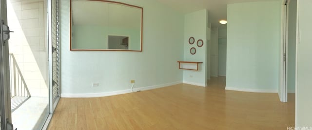 spare room with hardwood / wood-style flooring