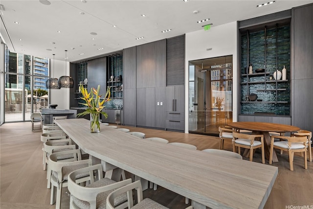 dining room featuring recessed lighting and floor to ceiling windows