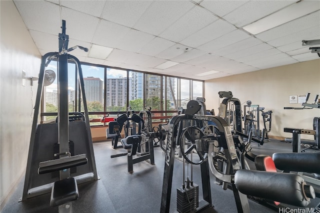 workout area with a paneled ceiling