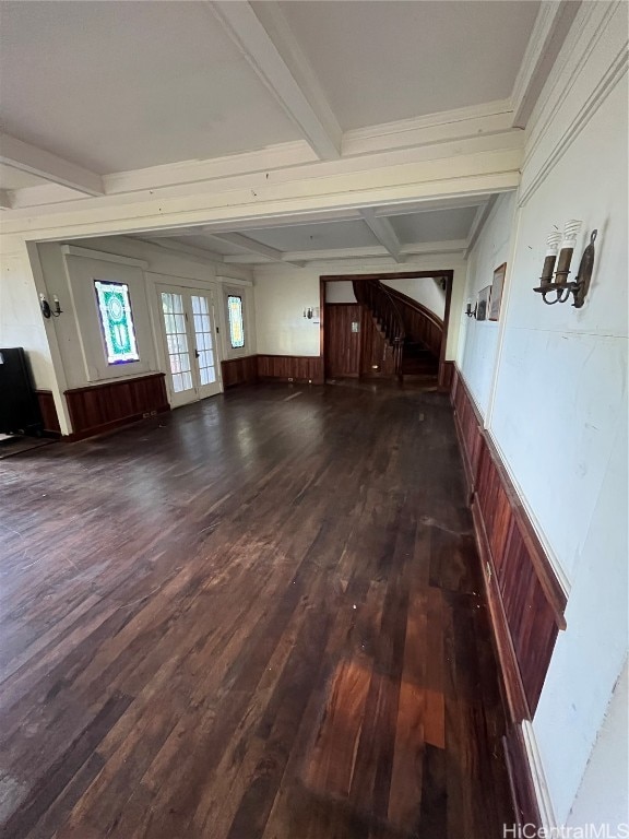 interior space featuring beamed ceiling, crown molding, dark wood-type flooring, and wood walls