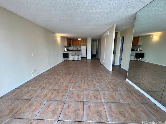 unfurnished living room with a textured ceiling