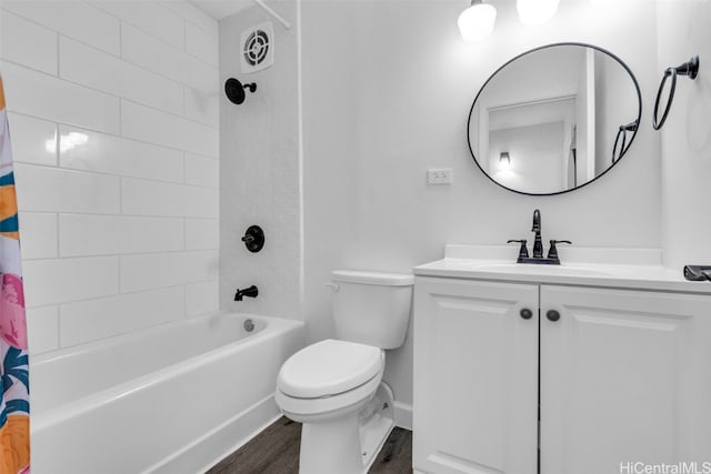 full bathroom with toilet, shower / tub combo, vanity, and hardwood / wood-style floors