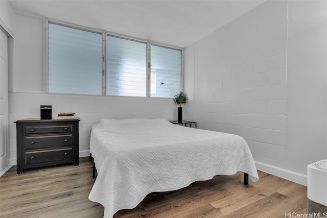 bedroom with light hardwood / wood-style flooring