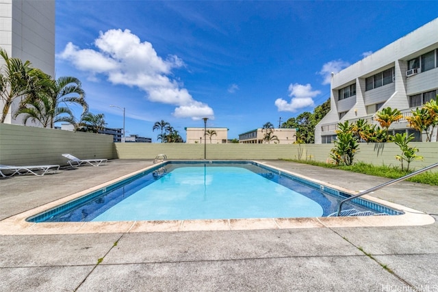 view of swimming pool featuring a patio area