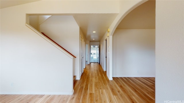 hall with light hardwood / wood-style floors