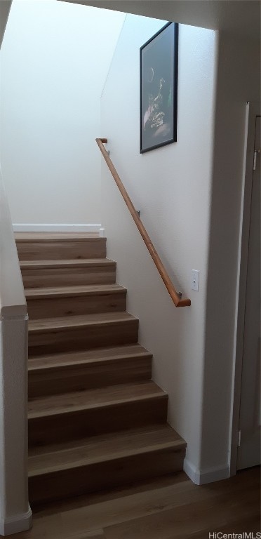 stairs with wood-type flooring