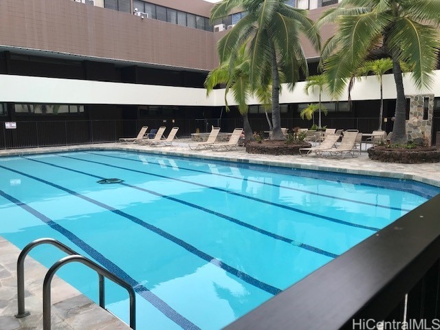 view of swimming pool featuring a patio area