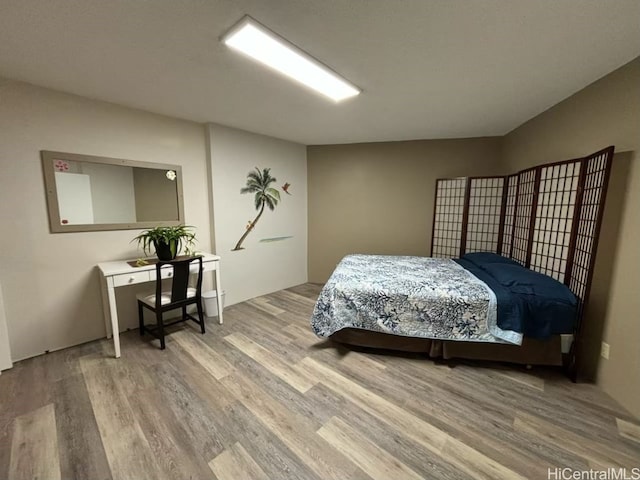 bedroom with light wood-type flooring