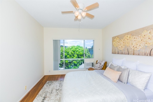 bedroom featuring ceiling fan and hardwood / wood-style flooring