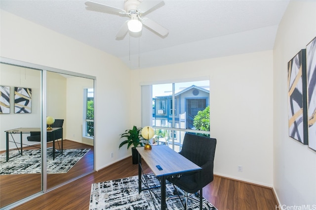 office area with ceiling fan, plenty of natural light, and dark hardwood / wood-style flooring