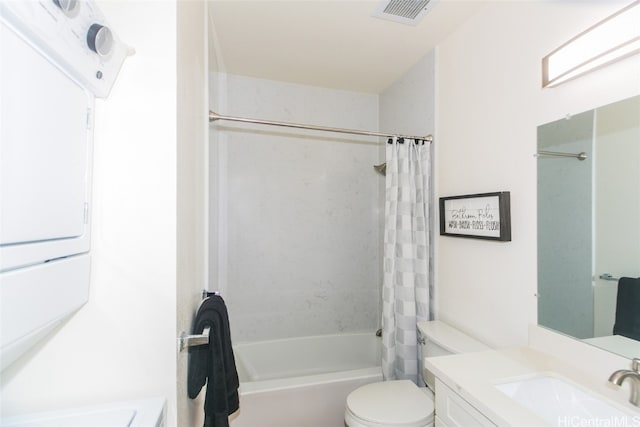 full bathroom with vanity, shower / tub combo, and toilet