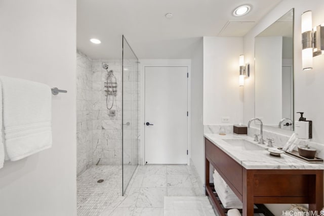 bathroom featuring vanity and tiled shower