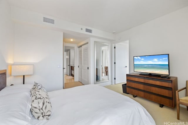 carpeted bedroom featuring a closet