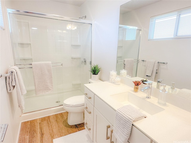 91-3525 Kauluakoko St Unit 2207, Ewa Beach, HI 96706 - full bathroom with a stall shower, toilet, vanity, and wood finished floors