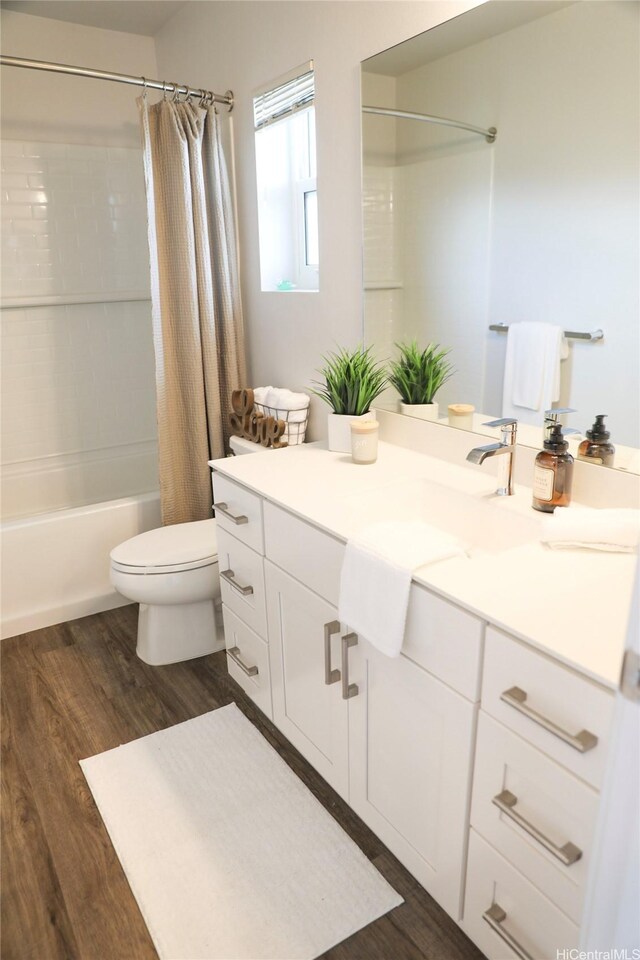 91-3525 Kauluakoko St Unit 2207, Ewa Beach, HI 96706 - full bathroom with wood finished floors, toilet, shower / bath combination with curtain, and vanity