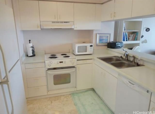 kitchen with sink and white appliances