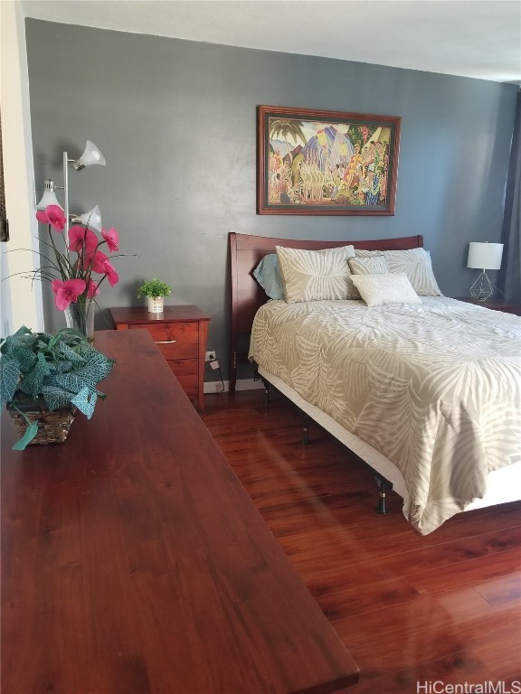 bedroom featuring dark hardwood / wood-style floors